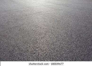 close-up horizontal view of new asphalt road - Shutterstock ID 180039677