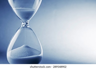 Closeup Hourglass Clock On Light Blue Background