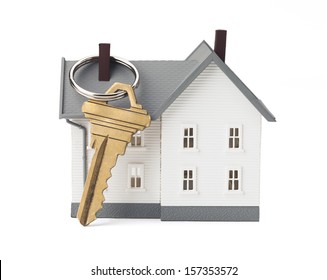 Closeup Of House And Key Isolated On White Background. Concept Of Real Estate. Clipping Path Included.