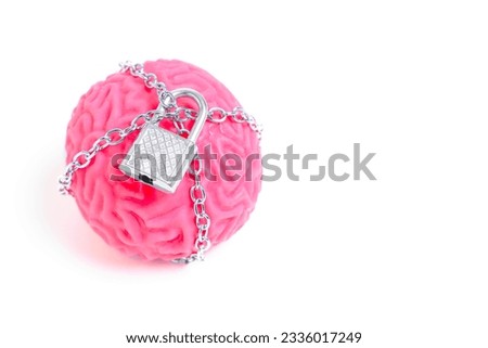 Close-up of a human brain replica confined by chains and secured with a padlock isolated on white. Mental Imprisonment related concept.
