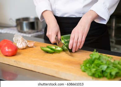 Closeup Of Human Hands Cooking Vegetables Salad In Kitchen. 