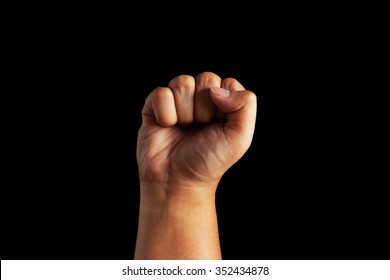 Closeup of human male hand - raised up clenched fist, on white background