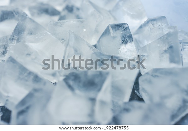 close-up of ice cubes in freezer tray with cold\
blue tones and contrasty\
tones
