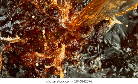 Close-up Of Ice Tea, Cola Or Beer, Abstract Top Down Beverage Background