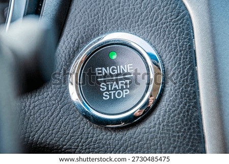 Close-up of the ignition and engine start button of a car
