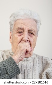 Closeup Of An Ill Senior Person Coughing