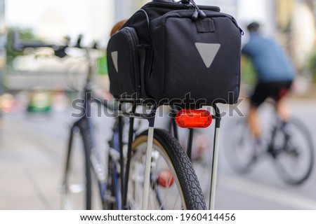 Similar – Image, Stock Photo Red bicycle luggage rack and rear light