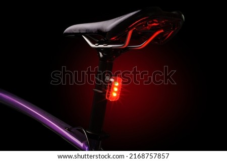 Close-up of illuminated bicycle tail light