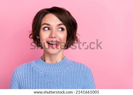Close-up image of beautiful lady looking empty space licking lips see cool advertisement isolated on pink color background