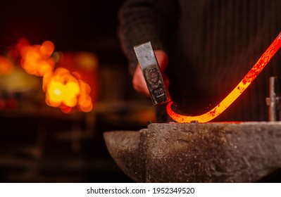 A Close-up Image Of A Blacksmith's Hands Forging A Spiral From A Red-hot Billet Against The Background Of A Forge. Handicraft Concept