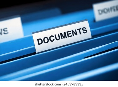 A close-up image of a blue file folder labeled DOCUMENTS