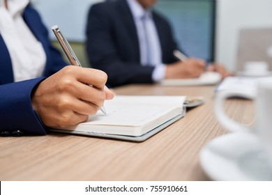 Close-up Image Of Buisness Woman Writing Plans And Ideas In Her Planner