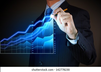 Closeup image of businessman drawing 3d graphics - Powered by Shutterstock