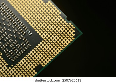 A close-up image of a computer CPU Semiconductor, focusing on the detailed array of gold-colored contact pins and the intricate grid pattern on the processor’s surface.