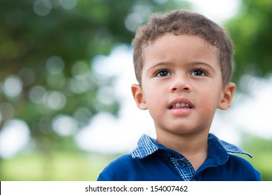 Close-up image of a cute little boy in the park - Powered by Shutterstock