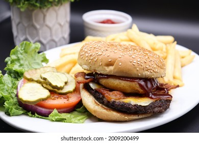 A Closeup Image Of A Delicious Western Burger (as I Call It). You Can See The Drizzle Of Bbq Sauce And The Crispy Onion Ring! Use This Image For Ads, Social Media, Websites, Etc! 