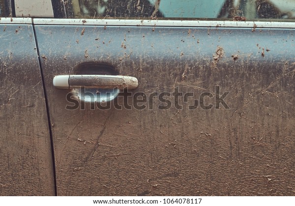 Close-up image of a dirty car after a trip\
around the countryside