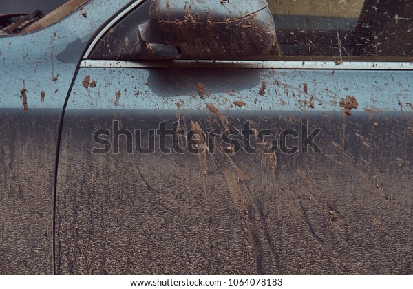 Close-up image of a dirty car after a trip
around the countryside