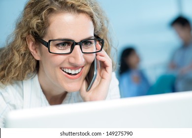 Close-up Image Of An Enthusiastic Business Lady Making A Phone Call