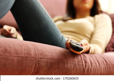 Closeup Image Of A Female Hand Holding Remote Control