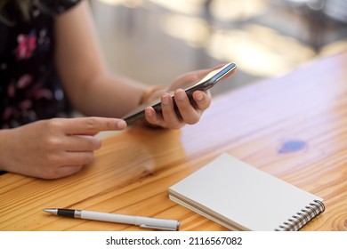 Close-up Image, Focus Hands, A Female Using A Smartphone Over Her Office Desk. Contact Someone, Social Media, Browse Internet