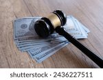 Closeup image of gavel and money. Fine, penalty, bribe concept.