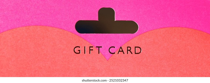 A close-up image of a gift card featuring a vibrant pink and orange design. Ideal for holidays, birthdays, or special occasions, adding a touch of joy and celebration.