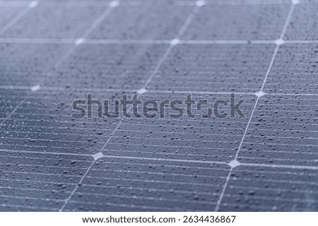 Close-up image of a grid-like solar panel, composed of darker photovoltaic cells in a square layout Realistic style, no human presence or environmental context, even lighting, muted colors, static a