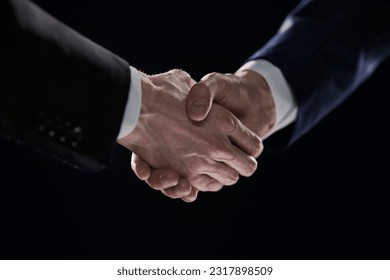 Close-up image of handshake between two colleagues.