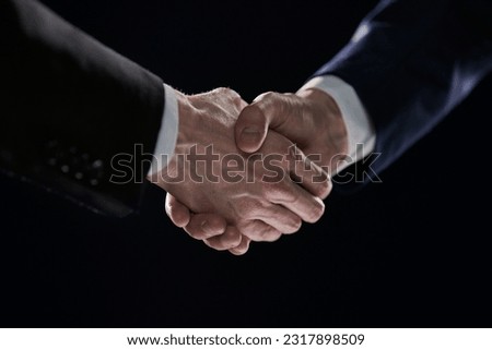 Close-up image of handshake between two colleagues.