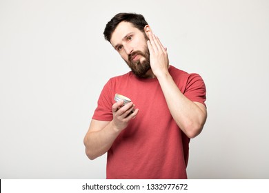 Close-up Image Of Handsome Bearded Man Holding  Beard Balm.