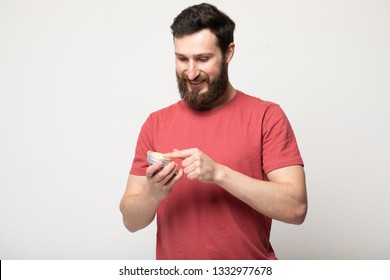 Close-up Image Of Handsome Bearded Man Holding  Beard Balm.