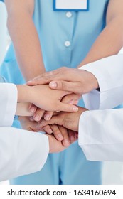 Close-up Image Of Healthcare Workers Stacking Hands To Support Each Other Befor Long Day Of Work