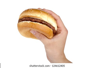 Close-up image of human's hand holding tasty hamburger isolated on a white background