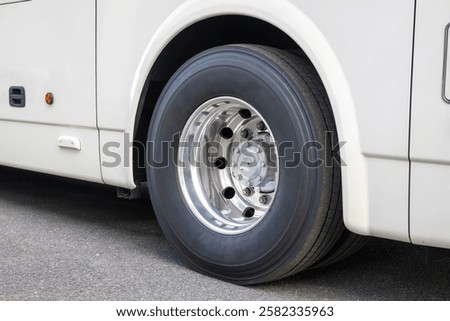 Close-up image of a large bus tyre.