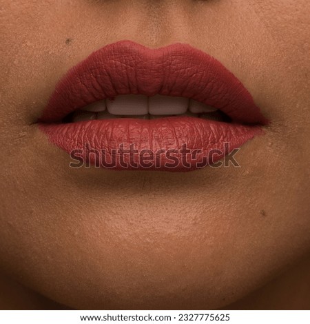 closeup image of lipstick color test on beautiful girl lips