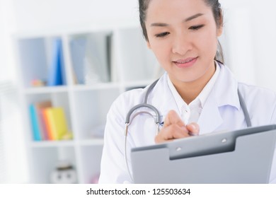 Close-up Image Of A Lovely Nurse Taking Notes