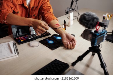 Closeup Image Of Male Beauty Blogger Swatching Eye Shadows From New Palette