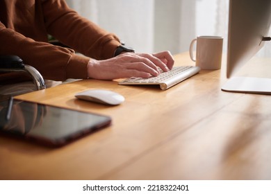 Closeup Image Of Man With Disability Sitting At Home Office Desk And Working On Computer