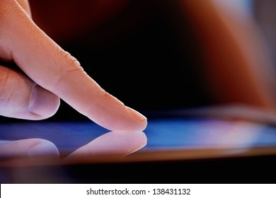 Close-up image of Man using digital tablet