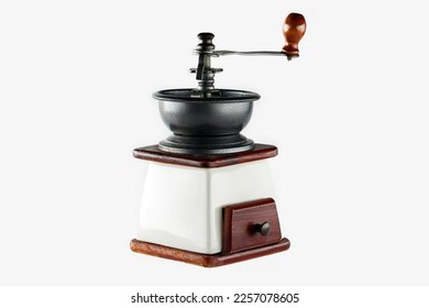 Closeup image of manual wooden coffee grinder isolated at white background.  - Shutterstock ID 2257078605