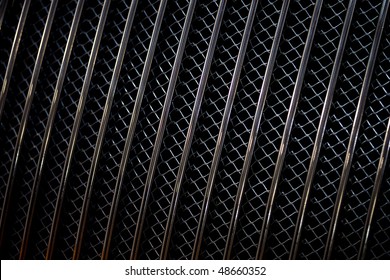 Closeup image of a metal car grill.
