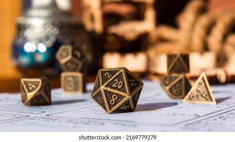 Close-up image of a metallic 20-sided die within the background polyhedral dice
