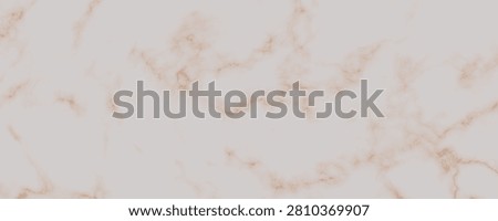 Closeup image of natural marble featuring delicate light beige base and soft pinkish brown veining throughout