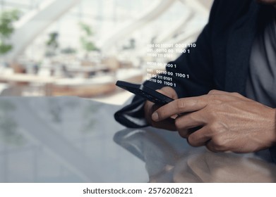 A closeup image of a person using a smartphone with binary code projected from the screen, symbolizing modern technology and digital communication.