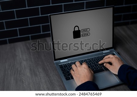 A close-up image of a person's hands typing on a laptop keyboard with a lock symbol on the screen. Cyber security and digital security concept.