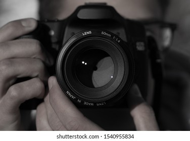 Close-up image of a photographer taking a picture - Powered by Shutterstock