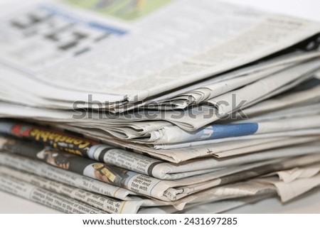 closeup image of a pile of newspaper