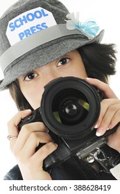 Closeup Image Of A Pretty Young Teen Ready To Take Photos For Her School Yearbook.  On A White Background.