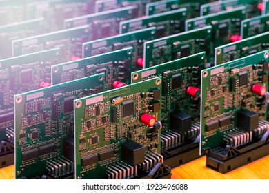 Close-up Image Of Produced Automotive Printed Circuit Boards With Soldered SMD Or Surface Mounted Components With Added Lens Flares. Horizontal Composition